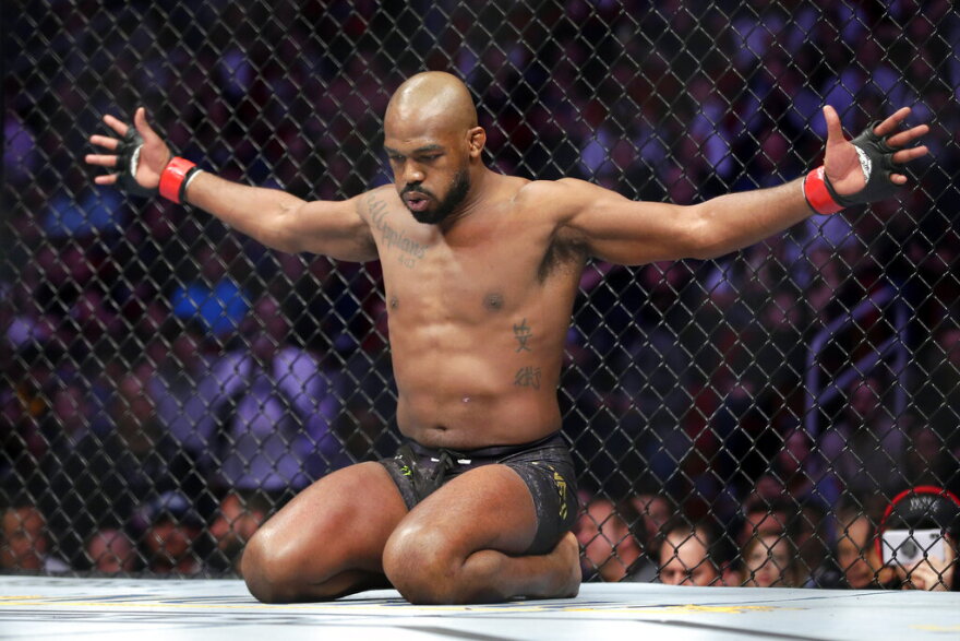 FILE -Jon Jones goes through his pre-fight routine in the ring before a light heavyweight mixed martial arts bout against Dominick Reyes at UFC 247, Saturday, Feb. 8, 2020, in Houston. Jones hired a team to help him get ready for Saturday, March 4, 2023, when he will take a step up to the heavyweight division and end any doubt — if any remain — that he is the greatest fighter in UFC history. (AP Photo/Michael Wyke)