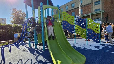 Students explore the playground they helped design at Whittier Elementary in South Scranton.