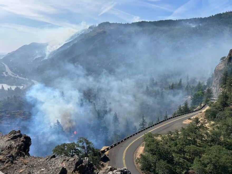 In this provided photo, a stretch of I-84 is viewed from the Rowena Curves, with the Rowena Fire burning nearby in June, 2025.