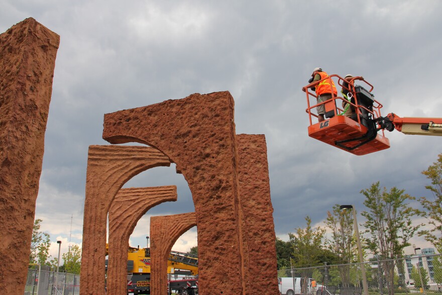 a videographer shoots a Thomas Sayre installation in Baltimore.