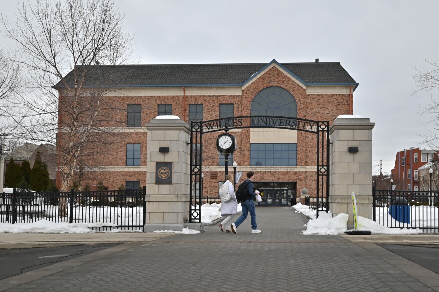 Students at Wilkes University walk to the Henry Student Center.