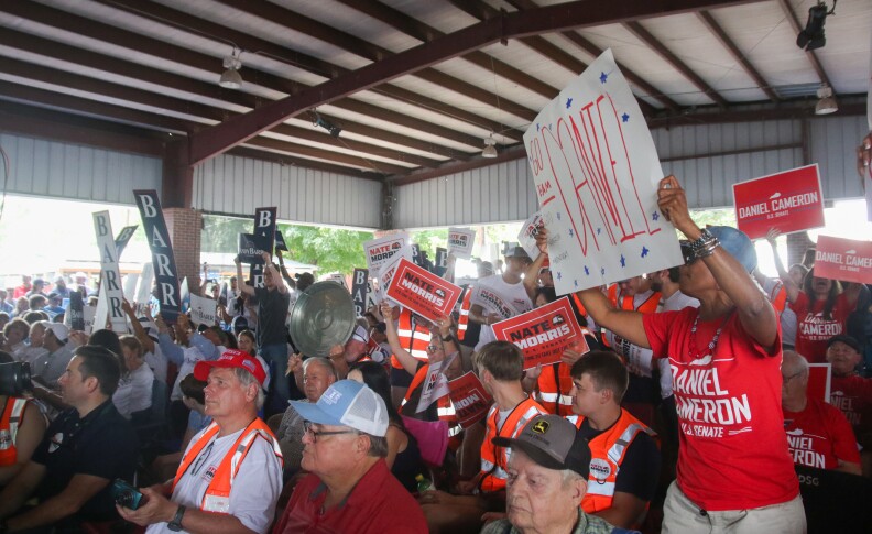 Supporters for the three top GOP candidates contending for one of Kentucky's U.S. Senate seats cheer as the trio began taking the stage ahead of the political speaking portion of the St. Jerome Picnic in Fancy Farm.