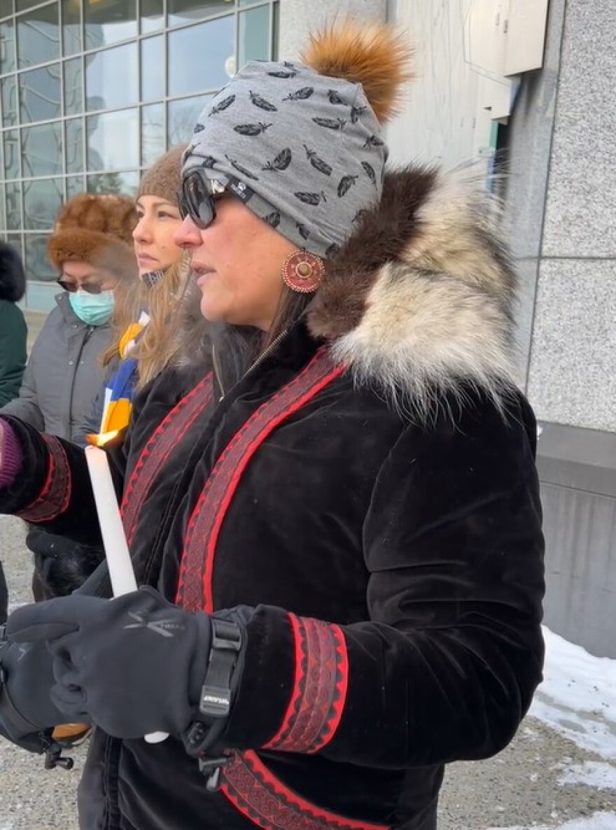 Dr. Jessica Black, president of the board of directors of Fairbanks Native Association, reads a letter from Shirley Lee, FNA's Justice Director.