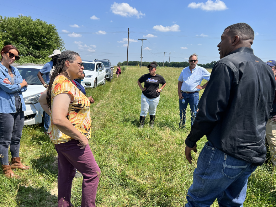 Earthea Nance (left) talks with T.J. Love (right) in Love’s pasture, while state, county and federal conservation officials listen. Nance is EPA Regional Director for Oklahoma and four other states.