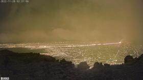 This image provided by the USGS Hawaiian Volcano Observatory shows a view from a research camera on the north rim of the summit caldera of the Maunaloa volcano, Monday, Nov. 28, 2022. The U.S. Geological Survey says the eruption began late Sunday night in the summit caldera of the volcano on the Big Island.