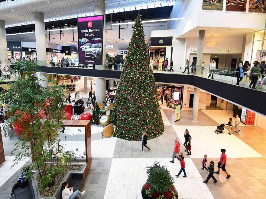 People walking at a shopping mall in Santa Anita, Cali. Majority of retailers and businesses across the country will close their doors early on Friday ahead of the Christmas holiday this year.