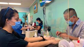 Salons have ramped up cleanliness and safety precautions, including barriers, increased sanitization, and masks. (Caitlyn McLaughlin/WUFT News)