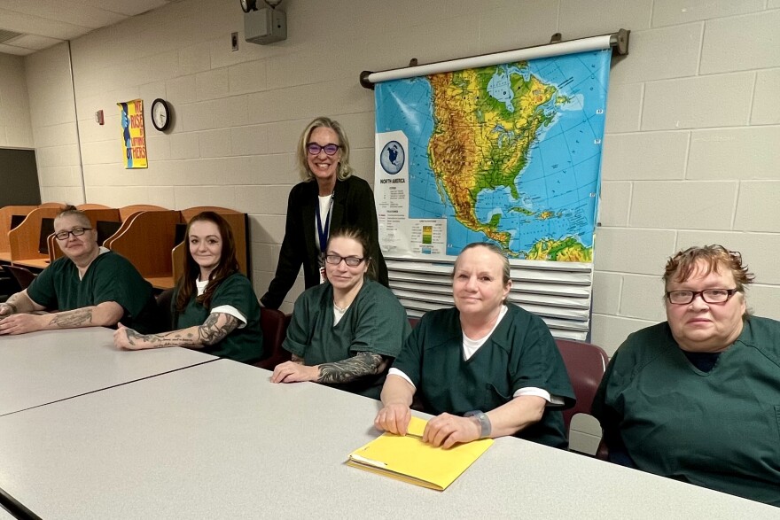 Students in the memoir class at the Barnstable County Correctional Facility — Jess Hutchins, Haley Hart LeBrie, Cassie Oliveira, Teri Hathaway, and Cheryl Gillette — pose with instructor K.C. Myers.