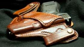 A gun sits in a holster.