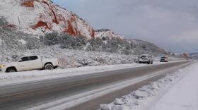 Navajo Police respond to a pickup truck that slid off the road on Route 12 near Navajo, N.M., on Jan. 8, 2026 amid a winter storm.