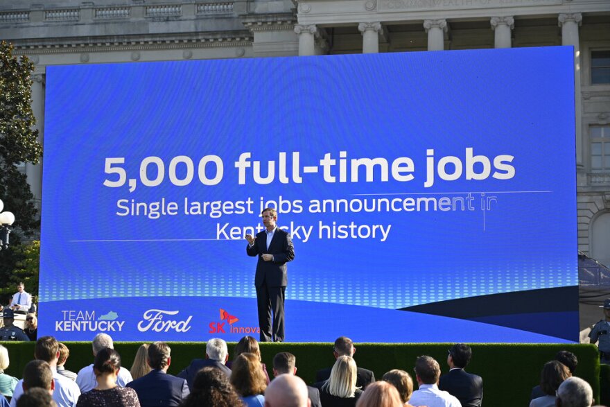 Kentucky Gov. Andy Beshear speaks during the official announcement of Ford Motor Company along with SK Innovations in building two electric battery factories in Glendale, Ky., at the Kentucky State Capitol in Frankfort, Ky., Tuesday, Sept. 28, 2021. The $5.8 billion dollar investment will provide 5000 full time jobs in the state. (AP Photo/Timothy D. Easley)