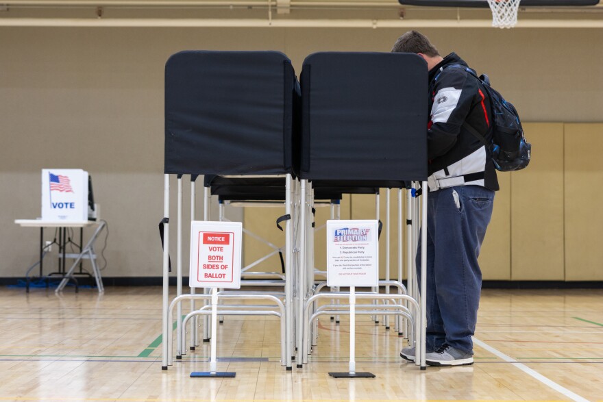 A voter in Saginaw Township fills out his ballot at Center Courts, a local community center turned polling location in the August 4 primary election.