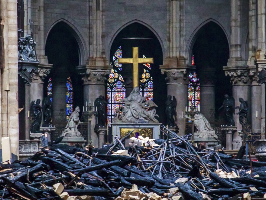 Debris are seen inside Notre Dame cathedral in Paris, Tuesday. Firefighters were able to salvage a number of the cathedral's most treasured relics.