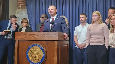 Illinois State Sen. Neil Anderson, accompanied by pastors and family at the Illinois Capitol on Tuesday, Feb. 17, speaks about his bill to outlaw abortion by legally defining fertilized human eggs as “people” and triggering homicide laws.