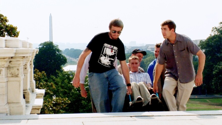 Iraq War veterans carry Tomas Young up the Capitol steps in Washington DC.