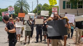 Demonstration organizer and former senator Clarence Payne leads protesters in call and response chants as they marched from Emancipation Garden to Government House to protest the Virgin Islands Water and Power Authority.