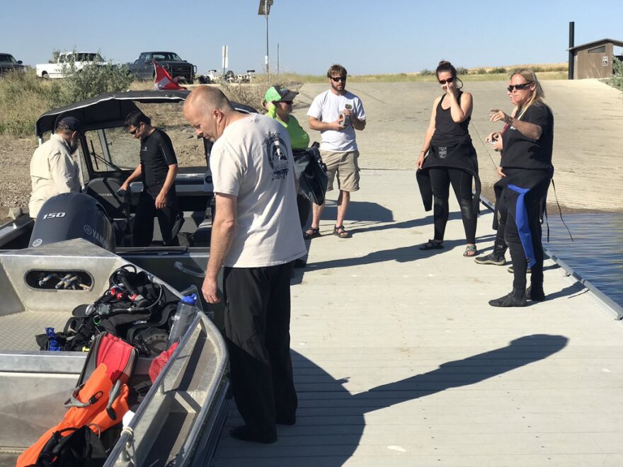 Divers with MontanaFWP & USFWS go over what to do if they get visual confirmation of quagga and or zebra mussels at Tiber Reservoir.