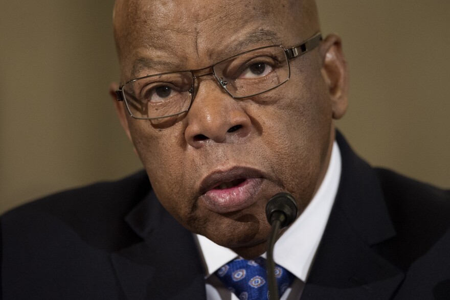 FILE - Former Rep. John Lewis, D-Ga., testifies on Capitol Hill in Washington on Jan. 11, 2017. New York’s governor signed the John R. Lewis Voting Rights Act, named after the late civil rights activist who represented Georgia in the U.S. House, into law Monday, June 20, 2022, intended to prevent local officials from enacting rules that might suppress people’s voting rights because of their race. (AP Photo/Cliff Owen, File)
