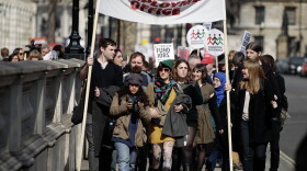Demonstrators march from Downing Street to the Houses of Parliament to protest against austerity measures as the Chancellor of the Exchequer George Osborne prepares to leave 11 Downing Street on Budget Day March 21, 2012 in London, England. Great Britain has re-entered a recession.