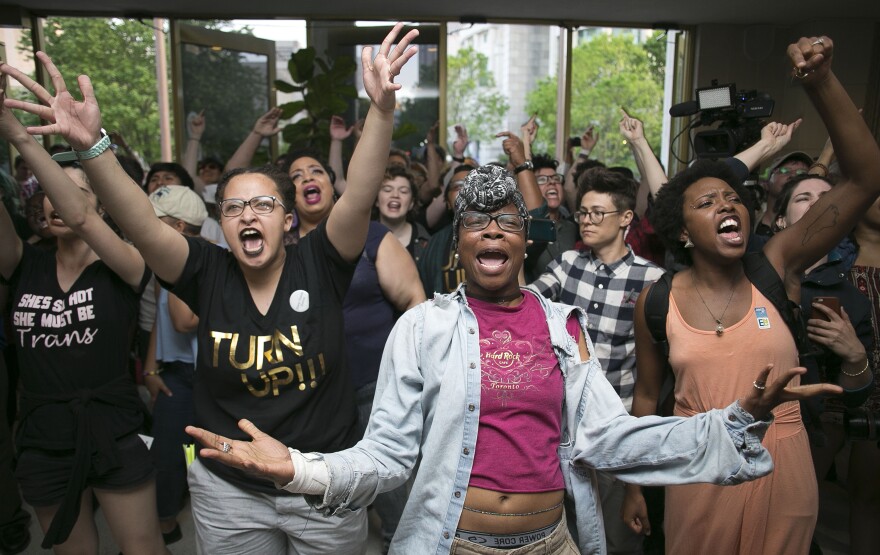 Krys Didtrey, left, and Gloria Merriweather, center, led chants in a Raleigh, N.C., statehouse protest in 2016 in opposition to HB2, a state law that, in effect, required people to only use designated bathrooms that matched the sex on their birth certificate. The law was repealed in 2017.