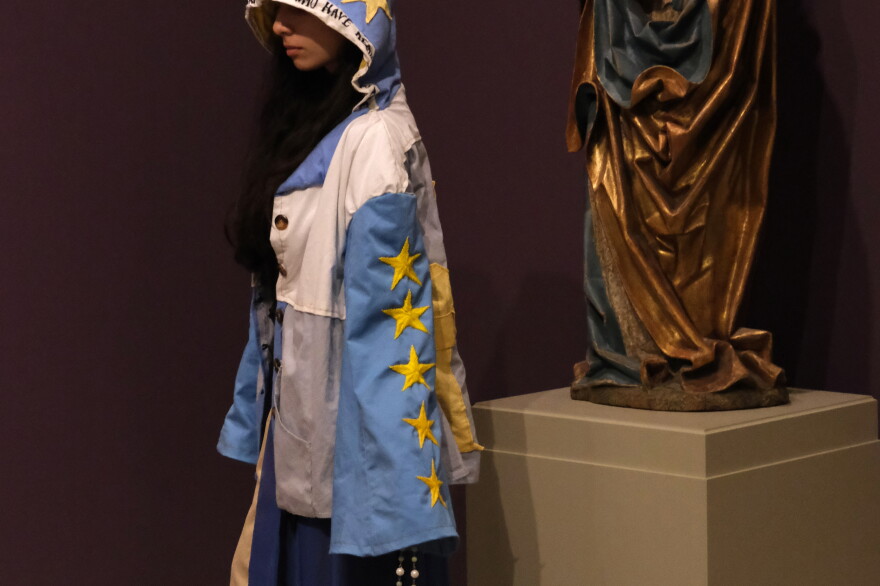 Governor's School for the Arts student Rachael Marsh dons a star-decorated cloak as part of the GSA annual Wearable Arts Exhibition at the Chrysler Museum of Art in March. 