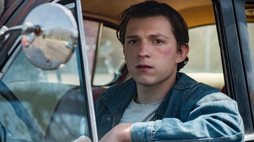 Tom Holland plays Arvin, a young man who refuses to let evil go unpunished in <em>The Devil All the Time. </em>