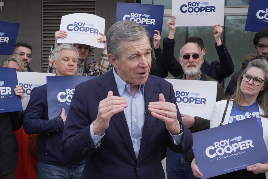Democratic former Gov. Roy Cooper, who is running for U.S. Senate, speaks to reporters after casting his ballot on the first day of in-person early voting in the state's primary election, Thursday, Feb. 12, 2026, in Raleigh, N.C.