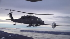 Members of the 210th and 211th Rescue Squadrons, Alaska National Guard, practice aerial refueling in an HH-60G Pave Hawk helicopter over Alaska January 21, 2021.