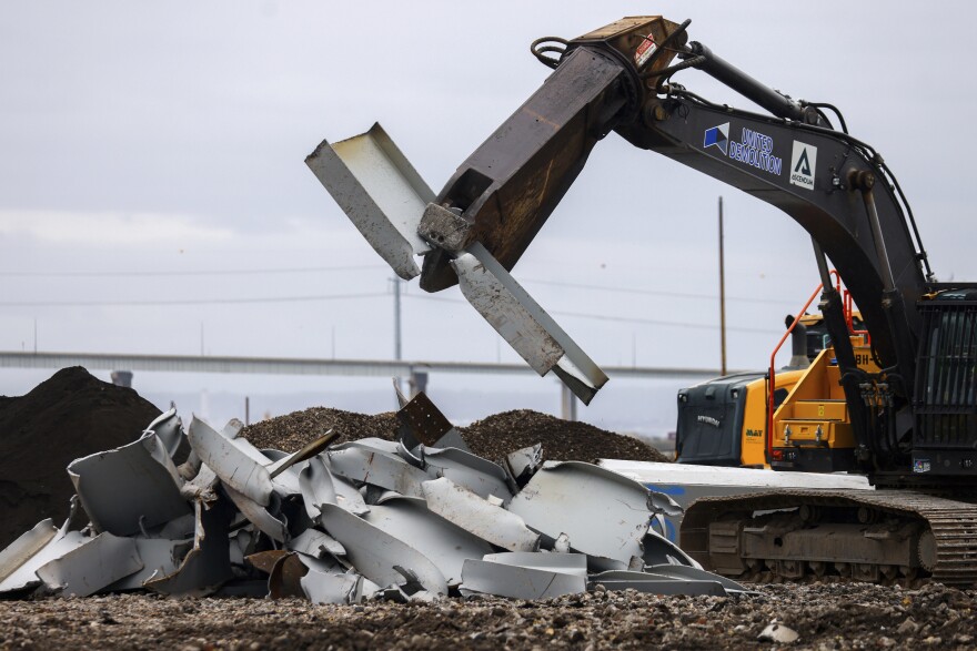 A shearer breaks apart salvaged pieces of the collapsed Francis Scott Key Bridge at Tradepoint Atlantic, Friday, April 12, 2024, in Sparrows Point, Md. (AP Photo/Julia Nikhinson)