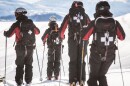 A photo showing ski patrollers skiing away from the camera at Jackson Hole Resort in Wyoming. 