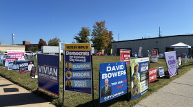 Signs adorn a street corner outside Roanoke's early voting site ahead of the 2026 election.