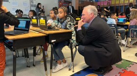 U.S. Rep. Tim Kaine looks on as students at Victory Elementary in Portsmouth work during a visit with U.S. Secretary of Education Miguel Cardona. (Photo by Laura Philion)
