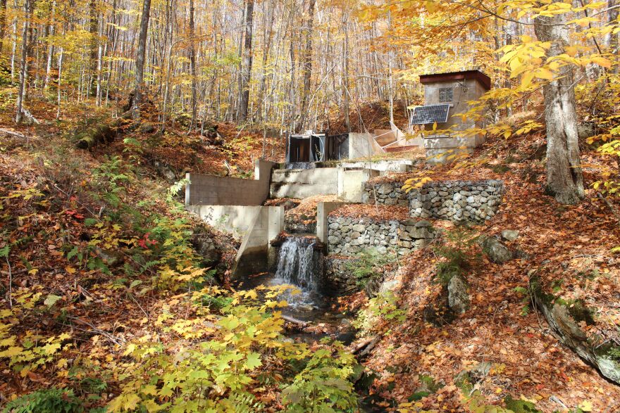 A weir in Hubbard Brook where initial samples showing the effects of acid rain were taken decades ago, leading to the passage of the Clean Air Act.