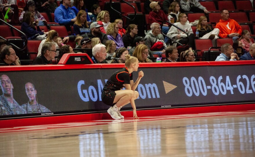 Girls high school basketball players inside an arena