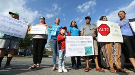 Protesters descended on the Hampton Inn in Mebane Thursday, June 13.