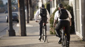 Photo of missionaries on bikes.