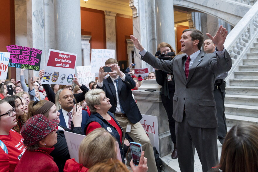 Kentucky Attorney General Andy Beshear speaks to a group of several hundred teachers and their supporters gathered to protest perceived attacks on public education at the Capitol, in Frankfort, Ky, Tuesday, March 12, 2019.