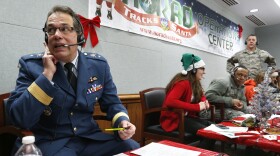Every year, NORAD staff and volunteers field calls from children inquiring about Santa. Canadian Brig. Gen Guy Hamel joined in the tradition in 2014.