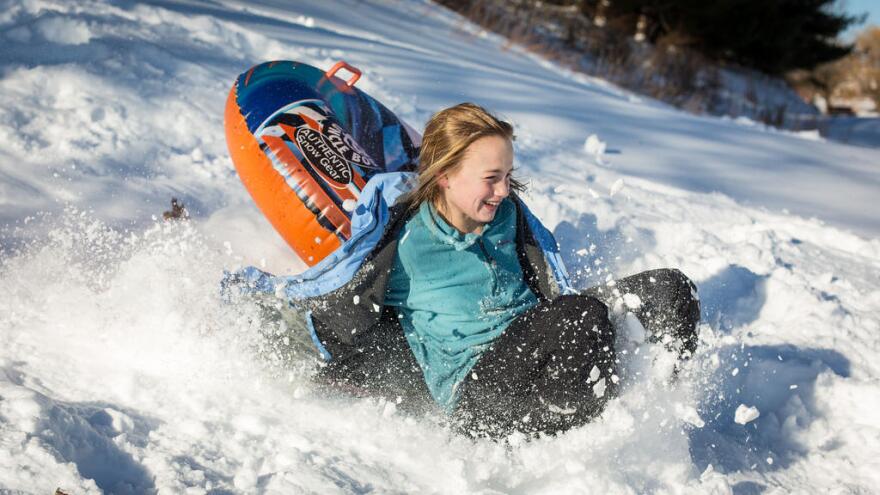 Sledding is popular winter activity at the  hill at 57th and Brookside. (Stock photo.)