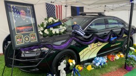  A memorial for Knox County Sheriff's Office deputy Nicholas D. Weist outside the Knox County Law Enforcement Center in Galesburg. Weist was killed in the line of duty on April 29. 