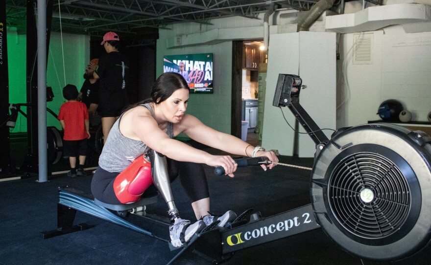 Jamie Blanek, a right-leg amputee, works out on the rowing machine during a group workout on April 8, 2026 at Waco Adapt. Blanek splits her time between Waco, her hometown, and Park City, Utah, where she trains with the National Ability Center in competitive snowboarding.