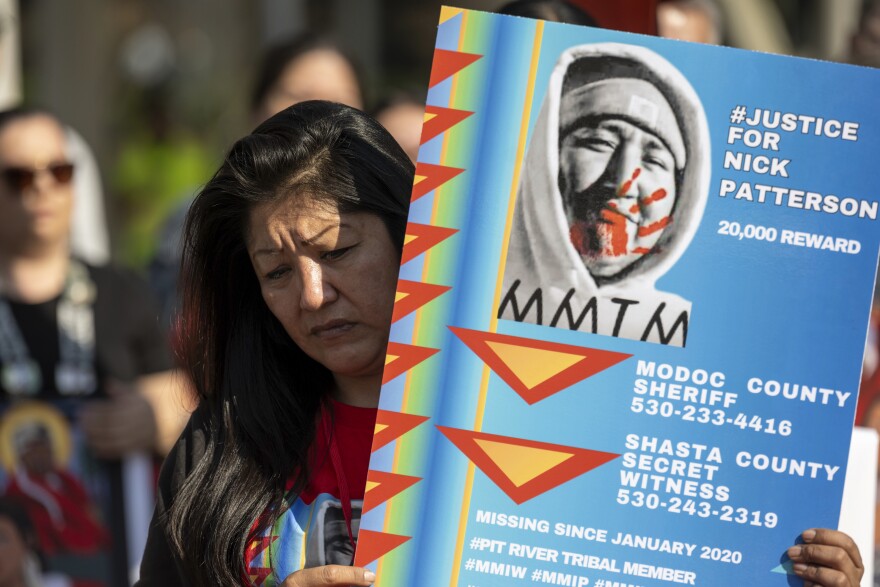 Lynette Craig holds a poster of her brother who went missing in 2020 while she and others listen to stories of the missing and murdered at the California State Capitol at the second annual Missing and Murdered Indigenous People Summit and Day of Action on Tuesday, Feb. 13, 2024, in Sacramento, Calif.
