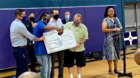 RecyleForce receives a check.