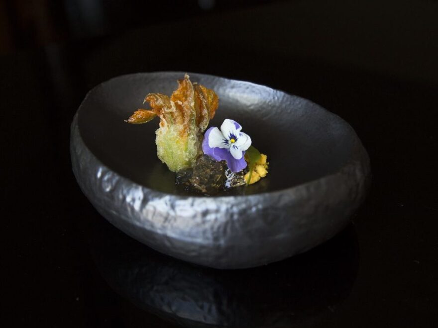 Blue crab, zucchini blossom and carrot served at N/Naka. The waiting list for Nakayama's restaurant is three months long, and it's not inexpensive. For nearly $200 each, diners can enjoy a 13-course, artfully plated culinary experience.