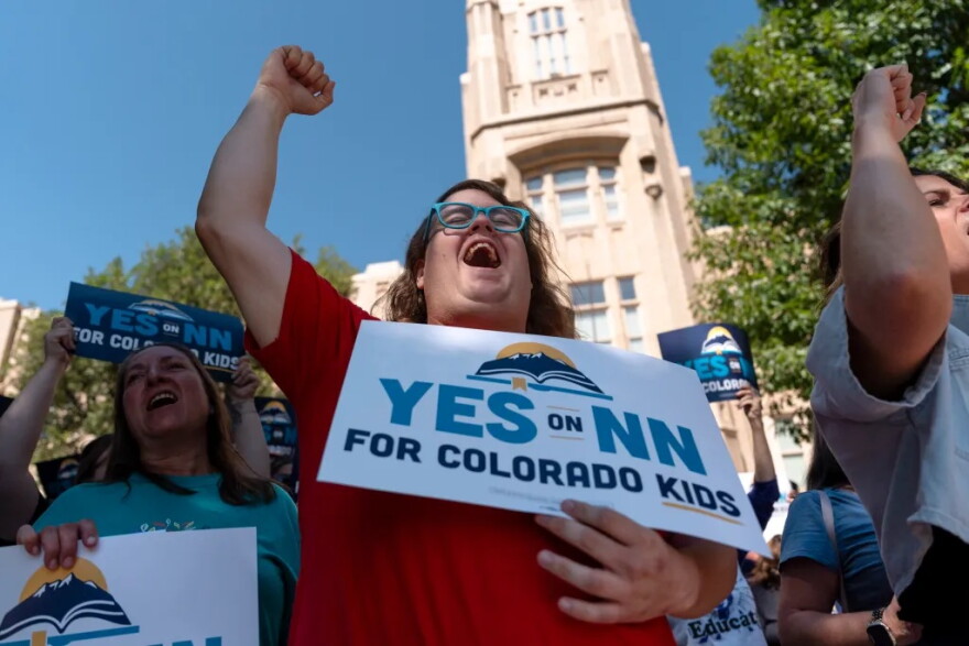 Supporters gather at the “Yes for Colorado Kids” campaign kickoff in support of Proposition NN at Denver West High School July 17, 2026, in Denver. Proposition NN seeks to bolster under-resourced public schools by using retained tax revenue to boost teacher salaries, lower class sizes, and expand vocational education.