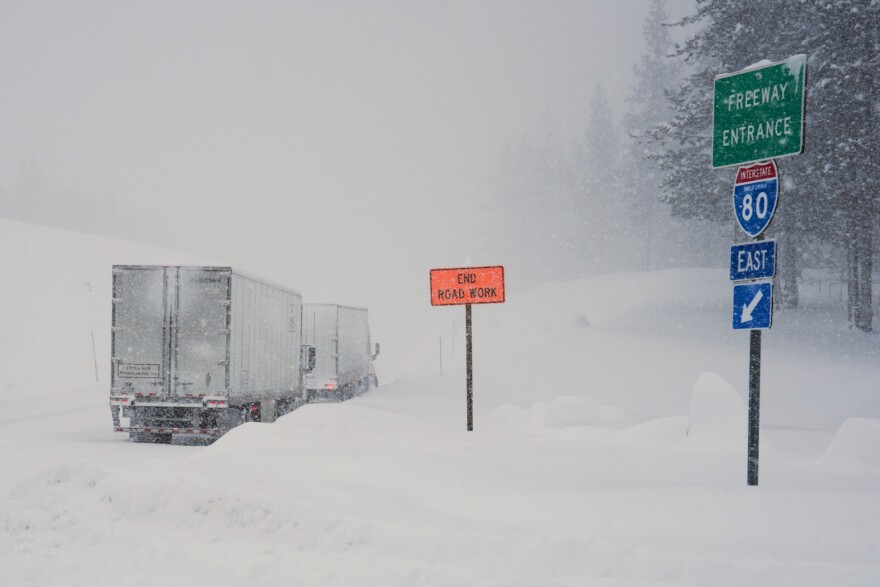 Trucks are lined up along Interstate 80 during a storm on Tuesday, Feb. 17, 2026 in Truckee Calif. (AP Photos/Brooke Hess-Homeier)