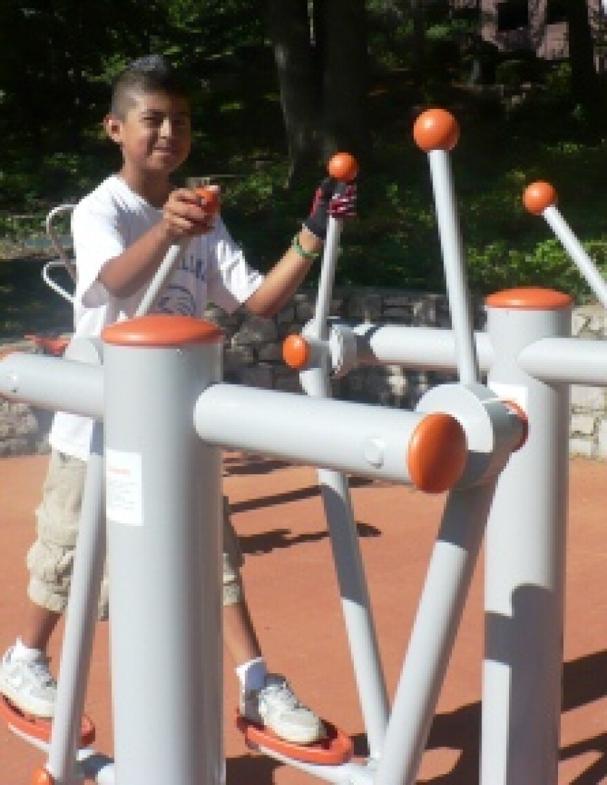 11-year-old Alberto Rosales likes using the elliptical equipment to train for sports.