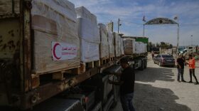 10/21/2023 Rafah, Palestine. The UN Relief and Works Agency for Palestine Refugees (UNRWA) takes delivery of humanitarian aid from the first convoy of relief trucks arriving from the Egyptian side at the Rafah border in Rafah, Gaza, on October 21, 2023. 