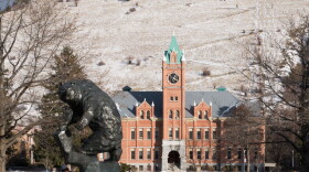Grizzly statue and Main Hall on the University of Montana campus in Missoula.