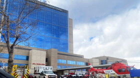 Ambulances line up at the entrance of the emergency room to drop off patients at Intermountain Medical Center in Murray, Utah, on Nov.11, 2020. Hospitals in the western state of Utah are preparing to ration care as COVID-19 patients flood their Intensive Care Units, according to local media. Utah Governor Gary Herbert, on Nov. 9, declared a state of emergency with a new mask mandate and other restrictions as Covid-19 cases surged and hospitals approach their capacity with record number of admissions. (STRINGER/AFP via Getty Images)